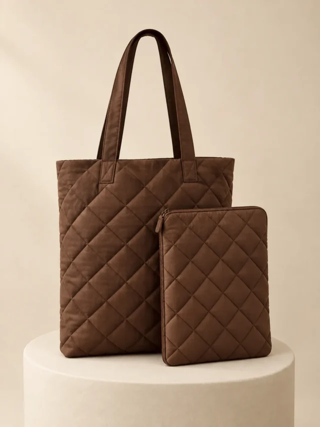 Book Tote & Sleeve Set in Cocoa, front view on a cream plinth