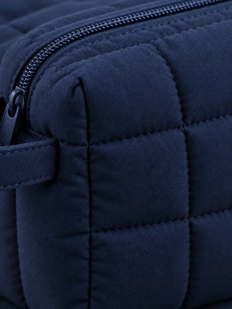 Close-up of the quilting and closure on the Boxy Wash Pouch