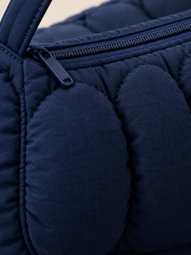 Close-up of the quilting and closure on the Bubble Row Baguette