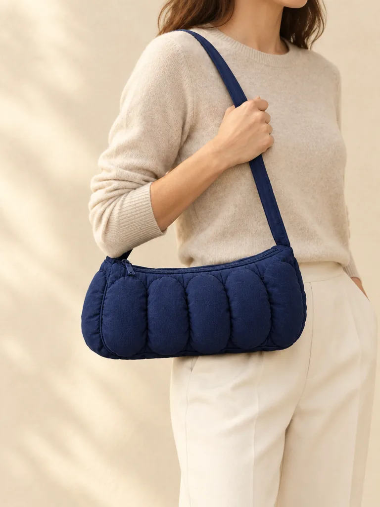 Bubble Row Baguette in Ink Navy, shown worn or carried to show its size