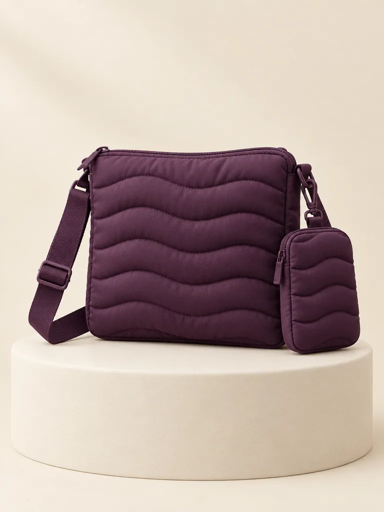 Crossbody & Clip Pouch Set in Plum, front view on a cream plinth