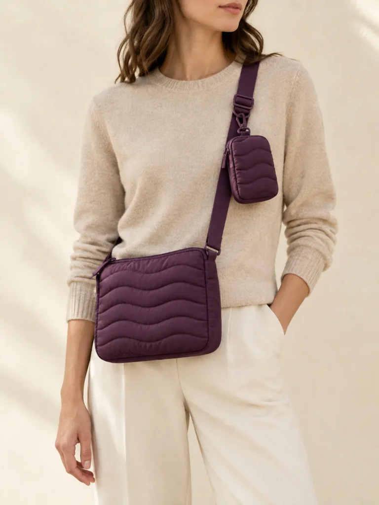 Crossbody & Clip Pouch Set in Plum, shown worn or carried to show its size