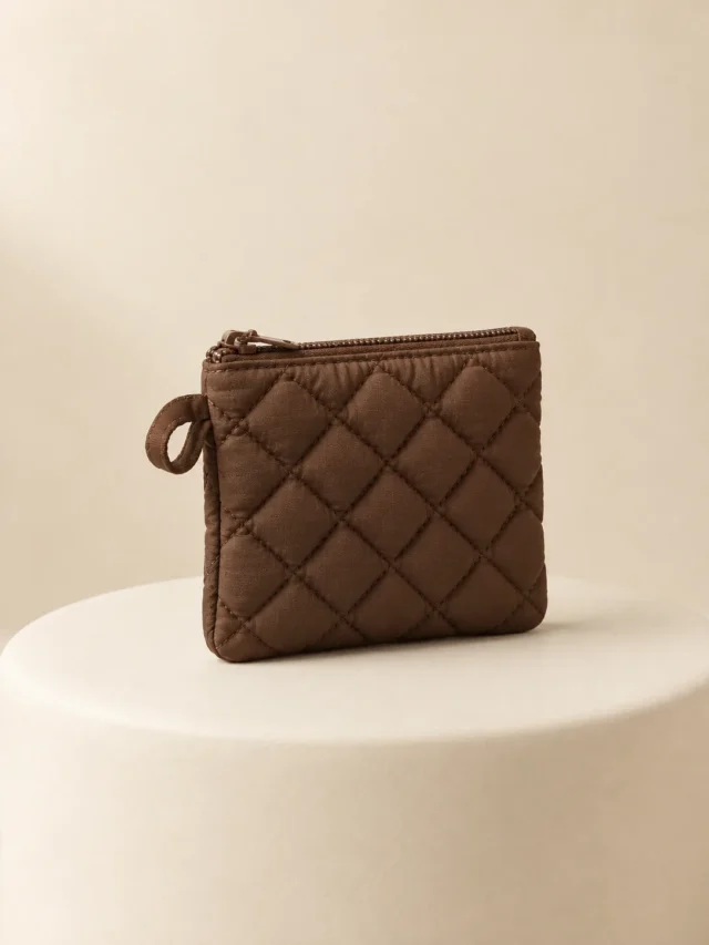 Diamond Card Pouch in Cocoa, front view on a cream plinth