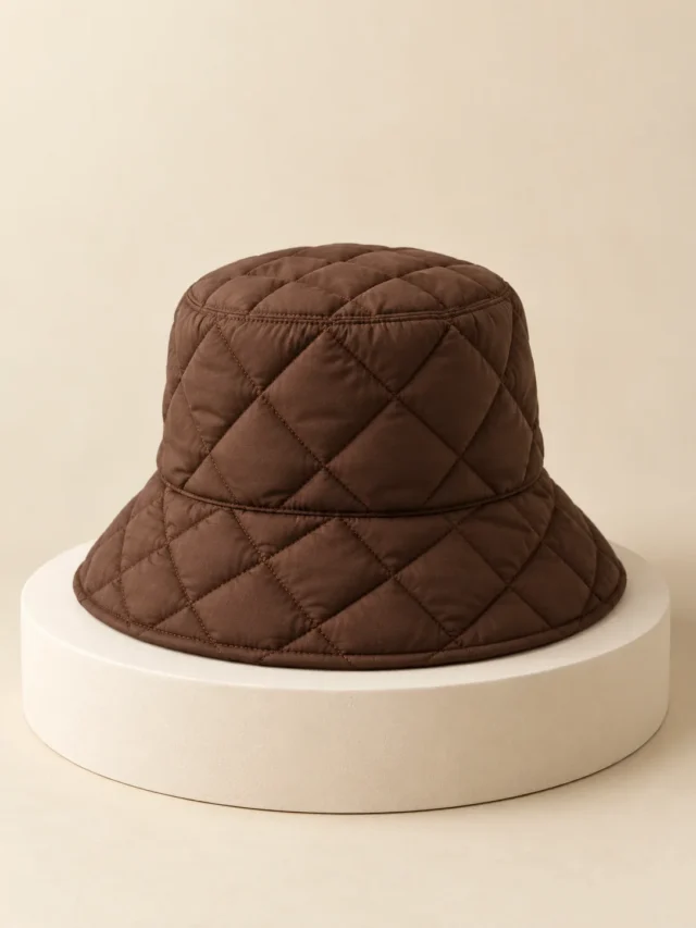 Diamond Puff Bucket in Cocoa, front view on a cream plinth