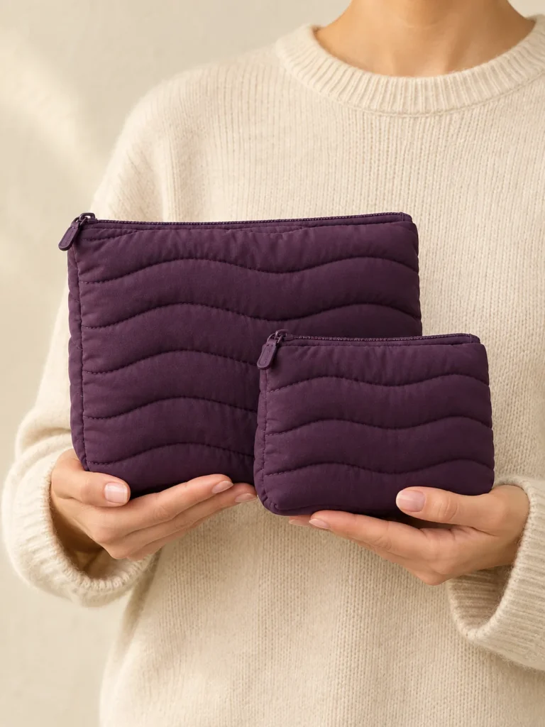 Duo Nest Pouch Set in Plum, shown worn or carried to show its size