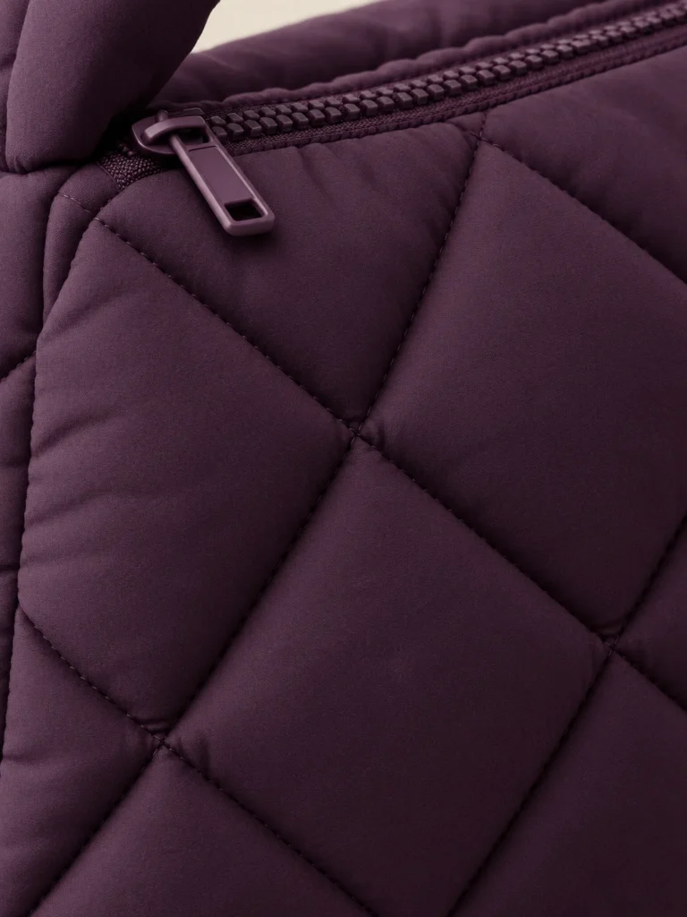 Close-up of the quilting and closure on the Knot Handle Puff