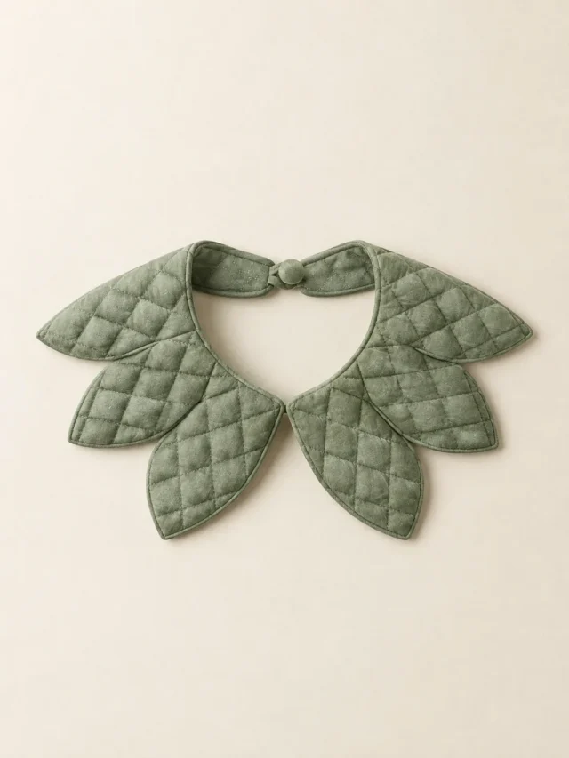 Petal Point Collar in Sage, front view on a cream plinth