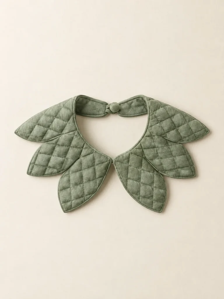 Petal Point Collar in Sage, front view on a cream plinth