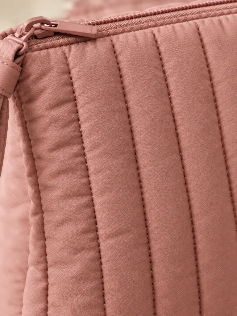 Close-up of the quilting and closure on the Pleat Pillow Wristlet