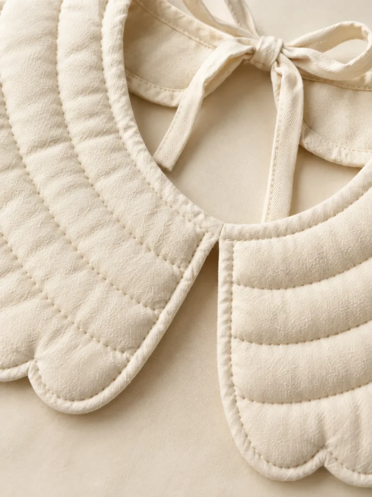 Close-up of the quilting and closure on the Scallop Puff Collar