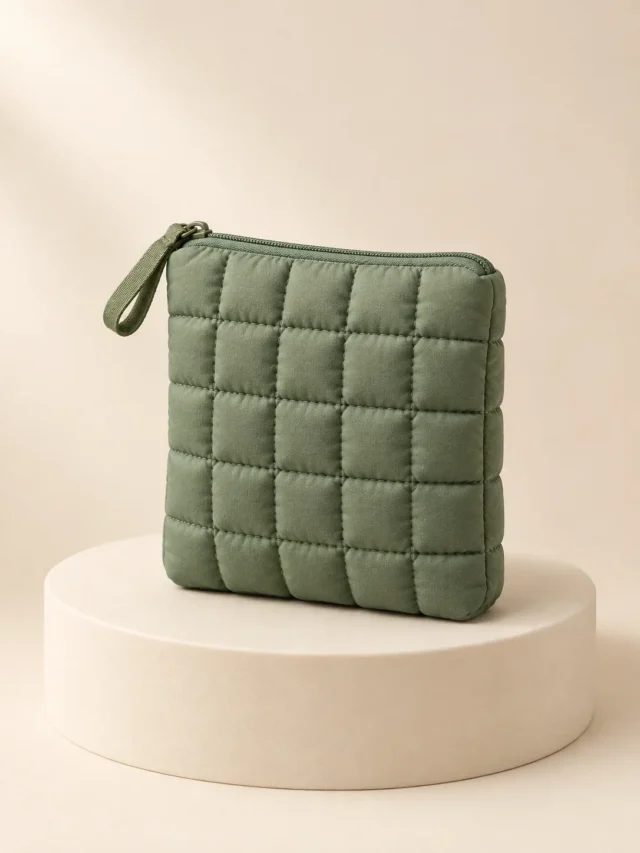 Soft Square Zip Pouch in Sage, front view on a cream plinth