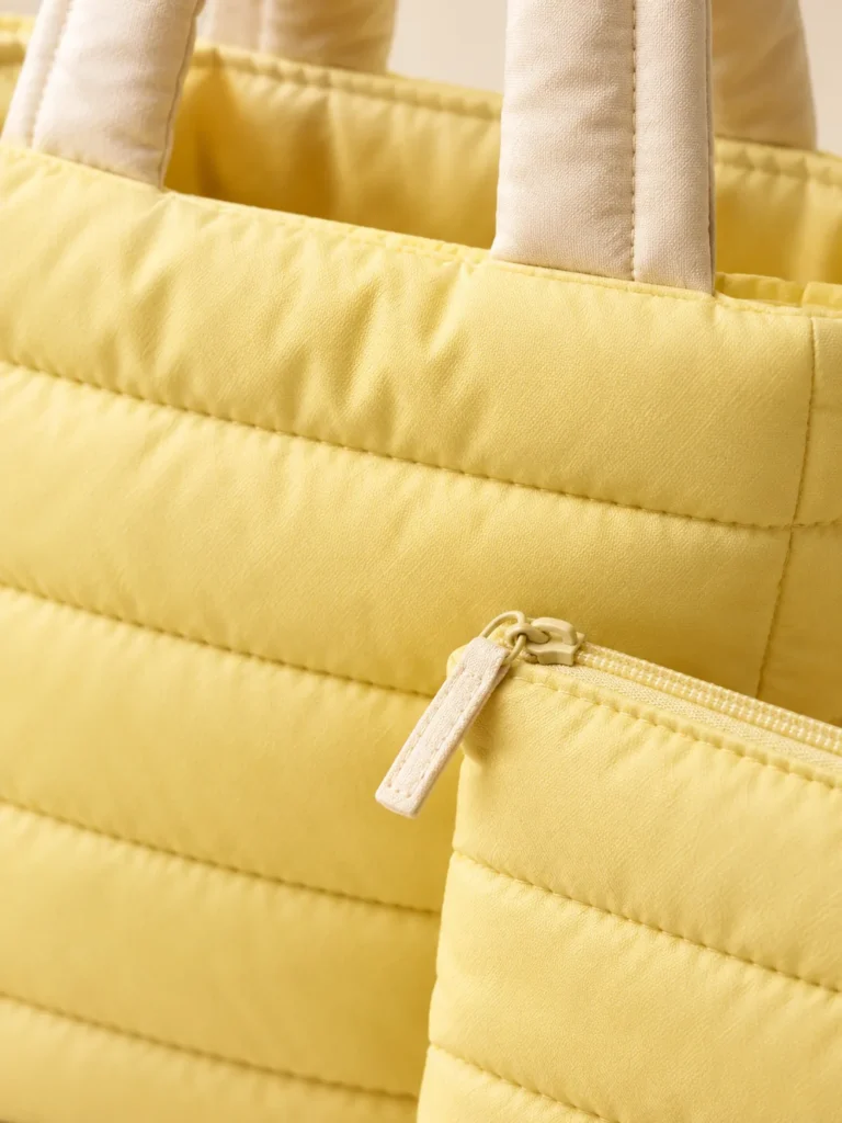 Close-up of the quilting and closure on the Wrap Handle Tote Set